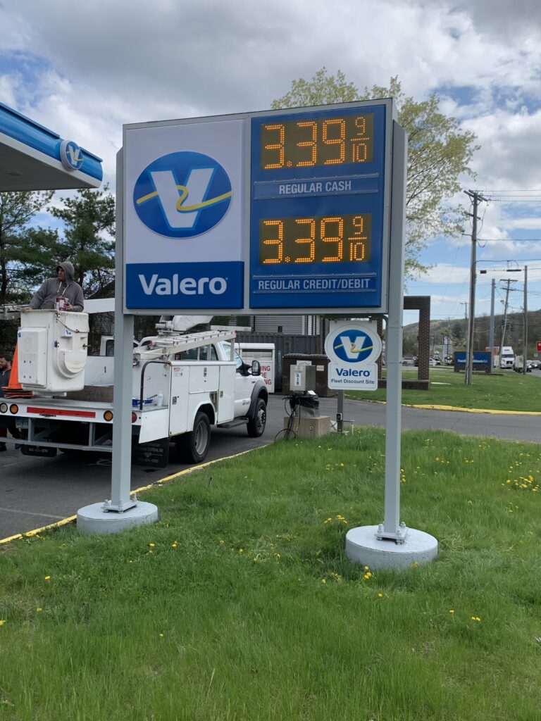 GAS Stations LED Digital Price Signs .GAS Stations- LED Digital Price Signs.LED Gas Station Pump Toppers.LED petrol pump toppers displaying fuel prices and promotional ads at a modern fuel station.